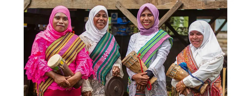 Four women with musical instruments in Sulawesi