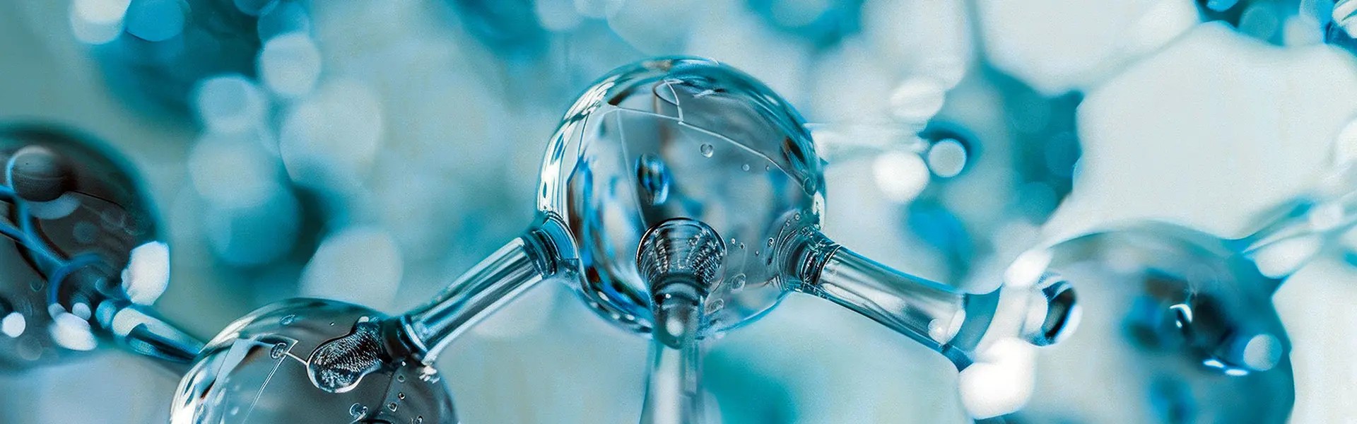 Close-up of a molecular structure with interconnected spheres and rods, predominantly in shades of blue. The image conveys a scientific and modern aesthetic, highlighting clear details of the molecules and their connections.